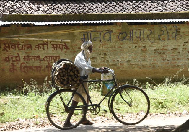 A man passing by a wall carrying anti-trafficking message in Jharkhand’s Gumla district (India). (Vipin Kumar/ Hindustan Times) A man passing by a wall carrying anti-trafficking message in Jharkhand’s Gumla district (India). (Vipin Kumar/ Hindustan Times)