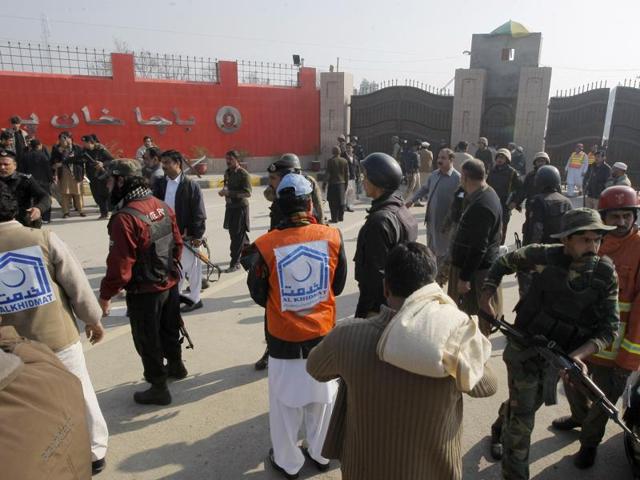 A teacher (L) walks with a pair of crutches following her rescue after a group of militants stormed the Bacha Khan University in Charsadda, Pakistan.(REUTERS) A teacher (L) walks with a pair of crutches following her rescue after a group of militants stormed the Bacha Khan University in Charsadda, Pakistan.(REUTERS)