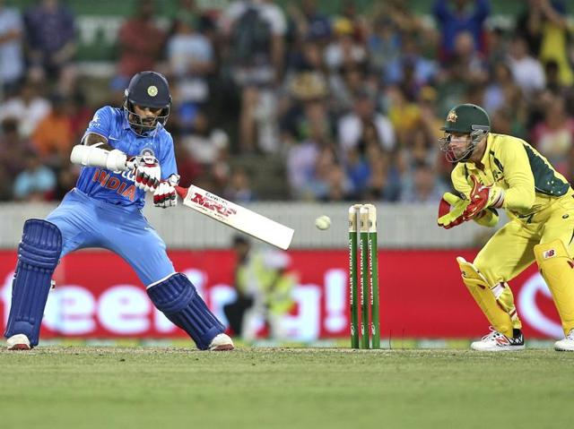 Indian batsman Shikhar Dhawan, left, plays a shot. (AP) 