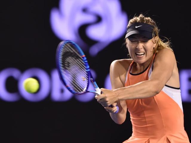 Russia's Maria Sharapova plays a backhand return during her women's singles match against Belarus's Aliaksandra Sasnovich on day three of the 2016 Australian Open. (AFP Photo) 
