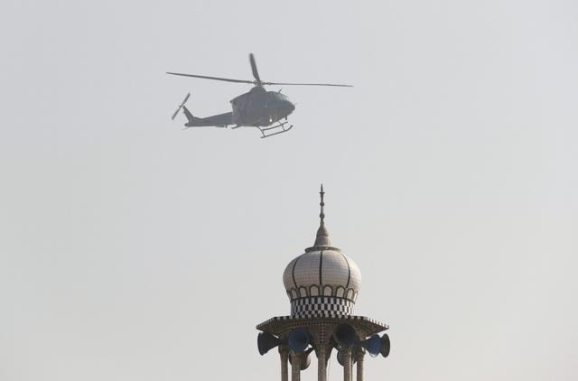 A military helicopter flies past a mosque during an operation after a militant attack at Bacha Khan University, in Charsadda, Pakistan. (REUTERS) A military helicopter flies past a mosque during an operation after a militant attack at Bacha Khan University, in Charsadda, Pakistan. (REUTERS)