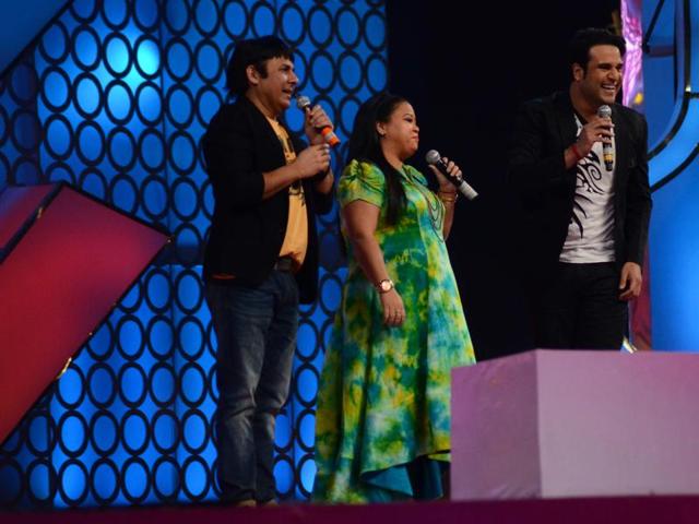 Comedians Krushna Abhishek, Bharti Singh and Sudesh perform at the annual Mumbai Police Melawa show in Mumbai on January 19, 2016.  (Viral Bhayani/HT) 