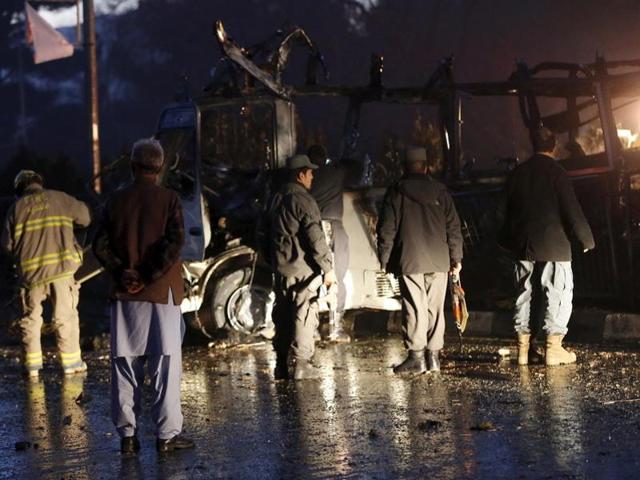 Afghan policemen and fire fighters inspect the wreckage of a bus that was hit by a suicide bomb attack, in an area near the Russian embassy in Kabul, Afghanistan. (Reuters Photo) Afghan policemen and fire fighters inspect the wreckage of a bus that was hit by a suicide bomb attack, in an area near the Russian embassy in Kabul, Afghanistan. (Reuters Photo)