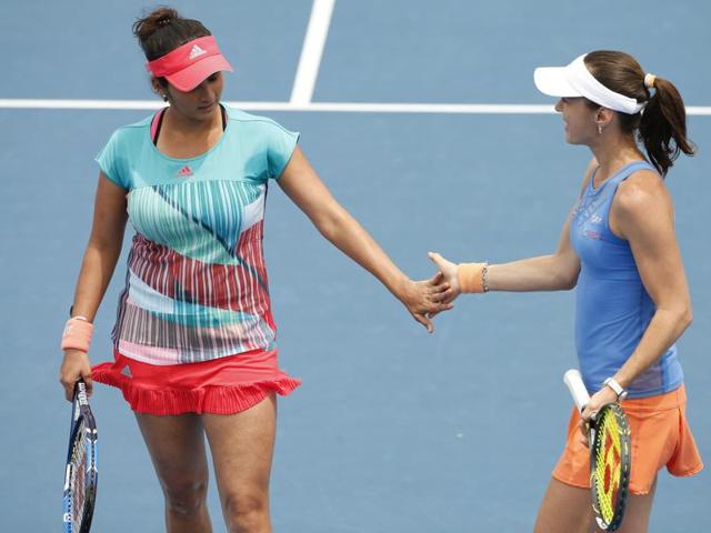 Switzerland's Martina Hingis, right, and India's Sania Mirza chat during their first round match against Brazil's Teliana Pereira and Colombia's Mariana Duque-Marino at the Australian Open in Melbourne on January 21, 2016. (AP Photo) Switzerland's Martina Hingis, right, and India's Sania Mirza chat during their first round match against Brazil's Teliana Pereira and Colombia's Mariana Duque-Marino at the Australian Open in Melbourne on January 21, 2016. (AP Photo)