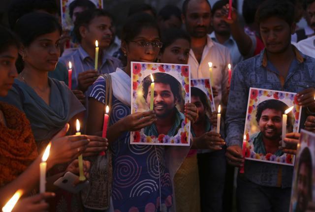 Activists of a Dalit organisation participate in a candle light vigil holding photographs of Rohith Vemula in Hyderabad. (AP Photo) Activists of a Dalit organisation participate in a candle light vigil holding photographs of Rohith Vemula in Hyderabad. (AP Photo)