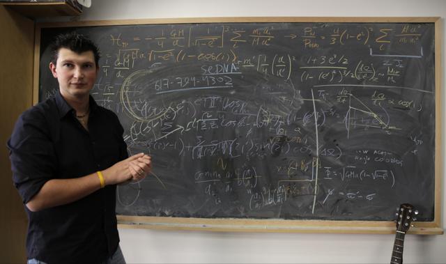 California Institute of Technology scientist Konstantin Batygin, Assistant Professor of Planetary Science comments on his research at his office in Pasadena, Calif., on Wednesday, Jan. 20, 2016. Scientists reported Wednesday, they finally have "good evidence" for Planet 9, a true ninth planet on the fringes of our solar system. (AP Photo)