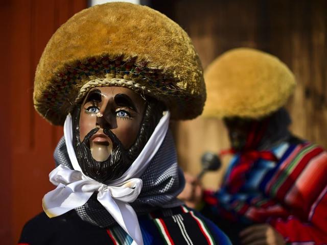 A masked man poses during the Parachicos celebration in Mexico. (AFP) A masked man poses during the Parachicos celebration in Mexico. (AFP)