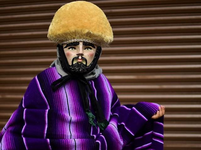 A masked man poses during Parachicos celebration in Mexico. (AFP) A masked man poses during Parachicos celebration in Mexico. (AFP)