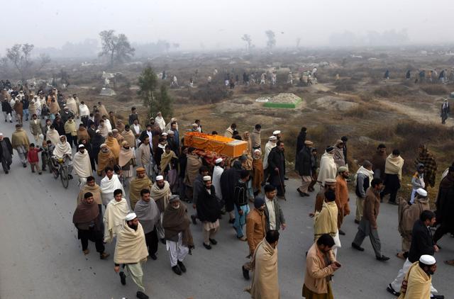 Pakistani relatives and residents carry the coffin of a victim of the January 20 Bacha Khan University attack. (AFP) Pakistani relatives and residents carry the coffin of a victim of the January 20 Bacha Khan University attack. (AFP)