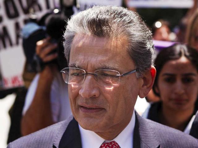 Former Goldman Sachs director Rajat Gupta will stay confined to his apartment until March with an ankle bracelet that will monitor his movements. (AP File Photo) Former Goldman Sachs director Rajat Gupta will stay confined to his apartment until March with an ankle bracelet that will monitor his movements. (AP File Photo)