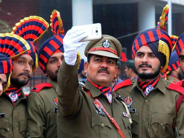 Punjab Police personnel taking a selfie during their full dress rehearsal of the Republic Day parade. (Karun Sharma/HT Photo) Punjab Police personnel taking a selfie during their full dress rehearsal of the Republic Day parade. (Karun Sharma/HT Photo)