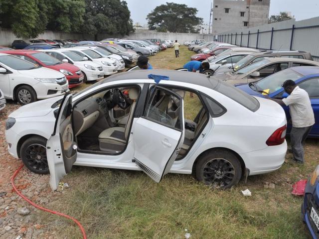 A luxury sedan getting a wash before putting up for auction at Tiruverkadu. (V Srinivasulu / HT Photo)