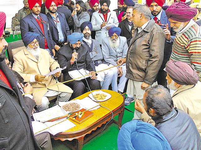 Chief minister Parkash Singh Badal listening the grievances at Shaheed Bhagat Singh Nagar on Friday.(HT Photo)