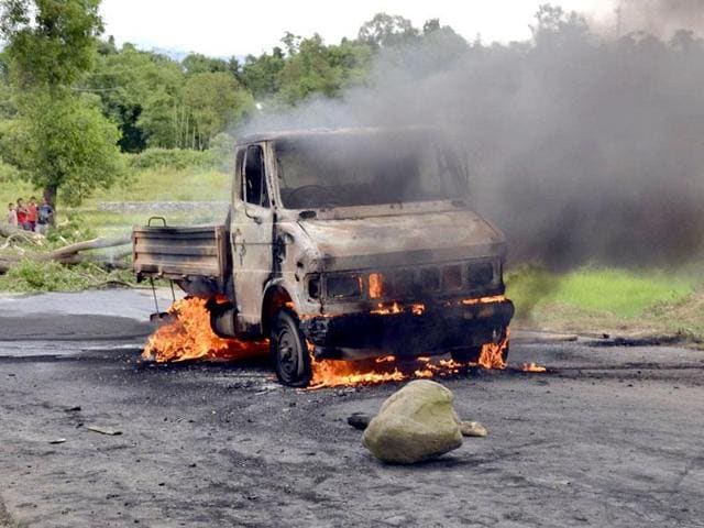 A vehicle is set on fire during a protest in Manipur on September 1, 2015. A vehicle is set on fire during a protest in Manipur on September 1, 2015.