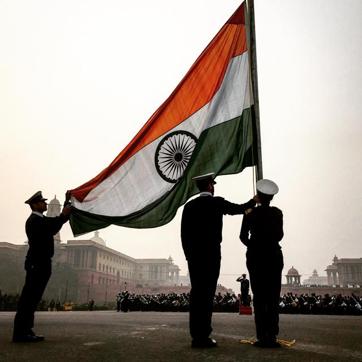 Indian Army personnel lower the national flag during Republic Day rehearsals at Vijay Chowk in New Delhi. Indian Army personnel lower the national flag during Republic Day rehearsals at Vijay Chowk in New Delhi.