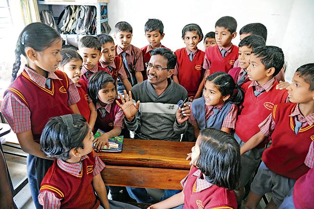 With money he earned as an extra, Madhukar Chaudhari has set up an English-medium school in his village. (HT photo )