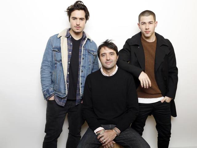 Actors Ben Schnetzer, left, and Nick Jonas pose with director Andrew Neel, centre, for a portrait to promote the film, Goat, during the Sundance Film Festival in Park City, Utah. (AP) Actors Ben Schnetzer, left, and Nick Jonas pose with director Andrew Neel, centre, for a portrait to promote the film, Goat, during the Sundance Film Festival in Park City, Utah. (AP)