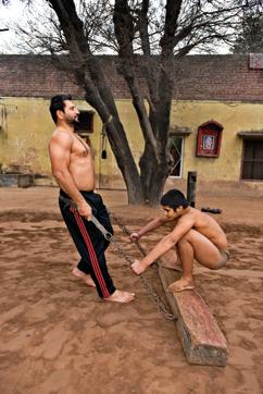 Log on to fitness: Paraminder Doomcheri, 43, often referred to as the Sachin Tendulkar of mud wrestling, pulls a log to strengthen his thigh muscles. (Photo by Gurinder Osan/ Hindustan Times) Log on to fitness: Paraminder Doomcheri, 43, often referred to as the Sachin Tendulkar of mud wrestling, pulls a log to strengthen his thigh muscles. (Photo by Gurinder Osan/ Hindustan Times)