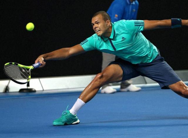 Jo-Wilfried Tsonga of France reaches for a forehand return during his fourth round match against Kei Nishikori of Japan. (AP Photo) Jo-Wilfried Tsonga of France reaches for a forehand return during his fourth round match against Kei Nishikori of Japan. (AP Photo)