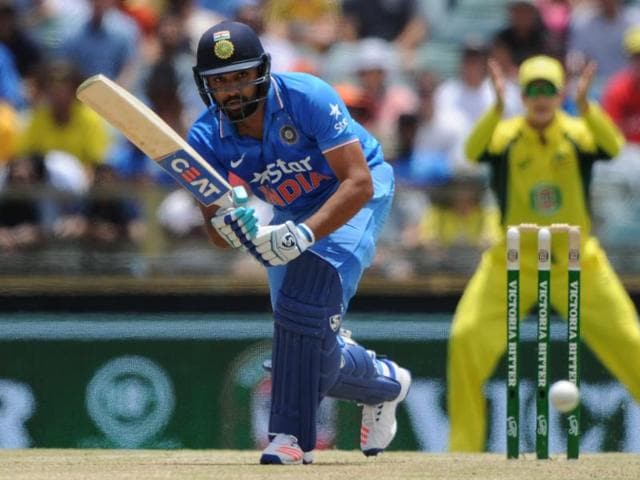 India's Rohit Sharma raises his bat after reaching 150 runs during the ODI against Australia in Perth. (AFP Photo) India's Rohit Sharma raises his bat after reaching 150 runs during the ODI against Australia in Perth. (AFP Photo)