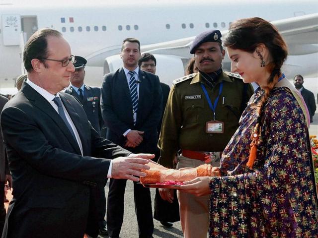 Hollande being presented a shawl on his arrival at Chandigarh Airforce Station on Sunday. (PTI)