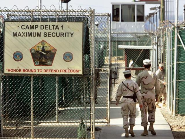 A File photo shows US military guards walk within Camp Delta military-run prison, at the Guantanamo Bay.(AP) A File photo shows US military guards walk within Camp Delta military-run prison, at the Guantanamo Bay.(AP)