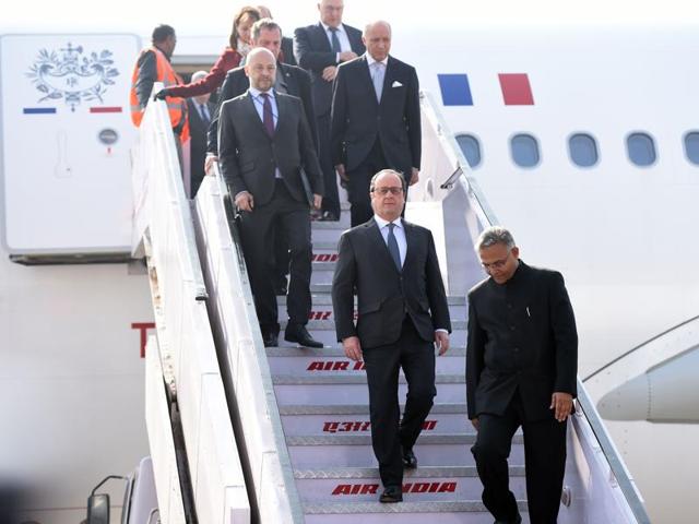 French President Francois Hollande (C) arrives at the Indian military base in Chandigarh on Sunday. (AFP)