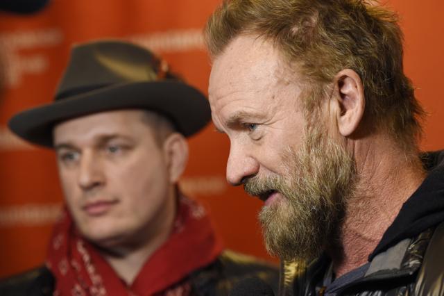 Sting, right, and J Ralph, co-writers of the song The Empty Chair are interviewed at the premiere of the documentary film Jim at the 2016 Sundance Film Festival. (AP)