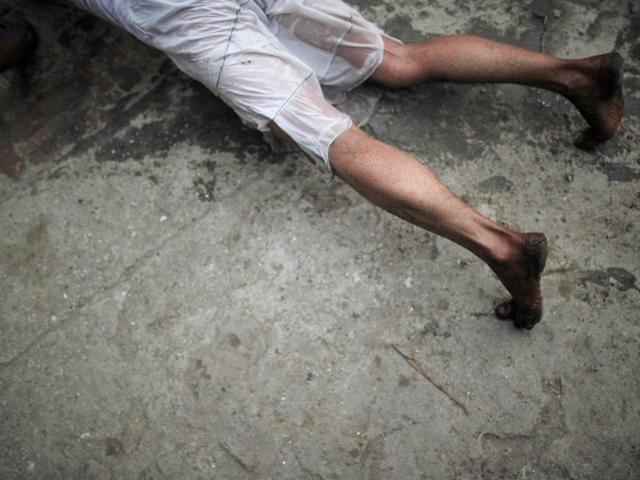 A Nepalese Hindu devotee prostrates on the ground as he prays outside a temple on the first day of month long Swasthani Bratakatha festival in Sankhu near Kathmandu. (Niranjan Shrestha/AP Photo) A Nepalese Hindu devotee prostrates on the ground as he prays outside a temple on the first day of month long Swasthani Bratakatha festival in Sankhu near Kathmandu. (Niranjan Shrestha/AP Photo)
