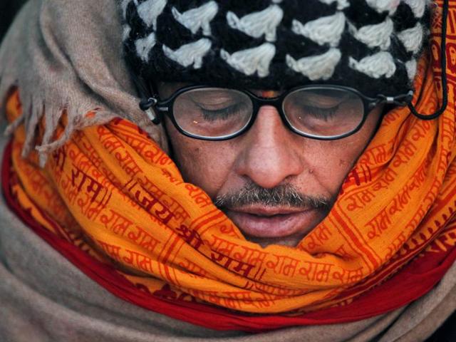 ‘Jai Shri Ram ’: A Nepalese priest wearing a saffron cloth offers a prayer during on the first day of Swasthani Bratakatha festival. (Niranjan Shrestha/AP Photo) ‘Jai Shri Ram ’: A Nepalese priest wearing a saffron cloth offers a prayer during on the first day of Swasthani Bratakatha festival. (Niranjan Shrestha/AP Photo)