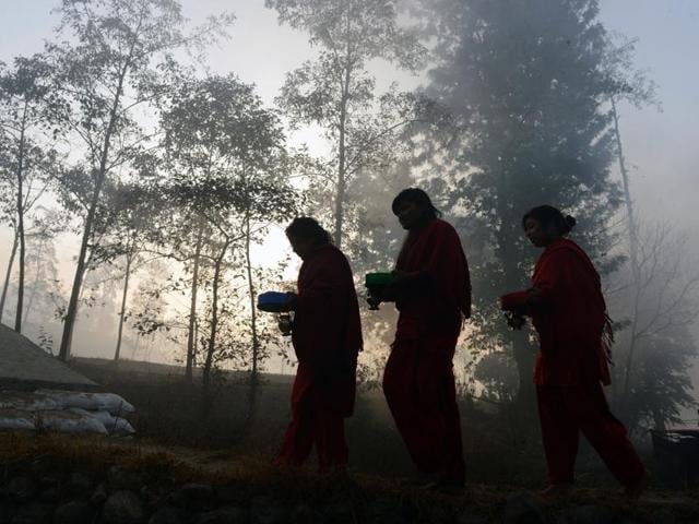 Hindu devotees walk near the holy River Sali on the outskirts of Kathmandu for Swasthani Bratakatha festival during which devotees recite holy scriptures dedicated to Hindu goddess Swasthani and Lord Shiva. (Prakash Mathema/AFP Photo) Hindu devotees walk near the holy River Sali on the outskirts of Kathmandu for Swasthani Bratakatha festival during which devotees recite holy scriptures dedicated to Hindu goddess Swasthani and Lord Shiva. (Prakash Mathema/AFP Photo)