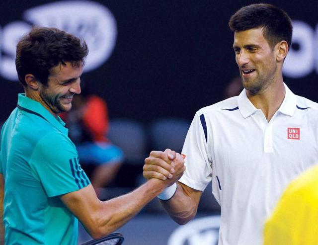 Novak Djokovic shakes hands with Gilles Simon after winning their fourth round match at the Australian Open. (AP Photo) Novak Djokovic shakes hands with Gilles Simon after winning their fourth round match at the Australian Open. (AP Photo)