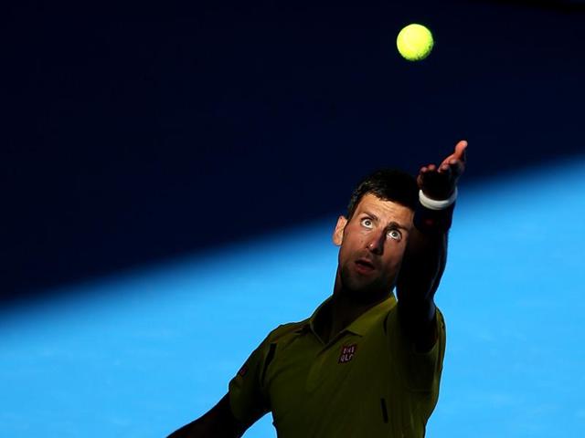Novak Djokovic of Serbia serves to Gilles Simon of France during their fourth round match at the Australian Open. (AP Photo) Novak Djokovic of Serbia serves to Gilles Simon of France during their fourth round match at the Australian Open. (AP Photo)