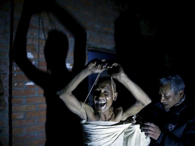 A devotee laughs as he gets ready to take part for the festival at Sankhu during the Swasthani Brata Katha festival in Kathmandu. (Navesh Chitrakar/Reuters) A devotee laughs as he gets ready to take part for the festival at Sankhu during the Swasthani Brata Katha festival in Kathmandu. (Navesh Chitrakar/Reuters)