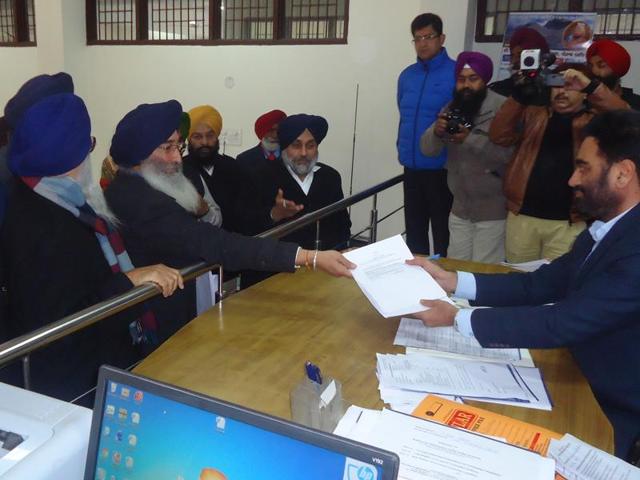 Ravinder Singh Brahmpura handing over the nomination papers to SDM Ravinder Singh on Monday.(HT Photo)