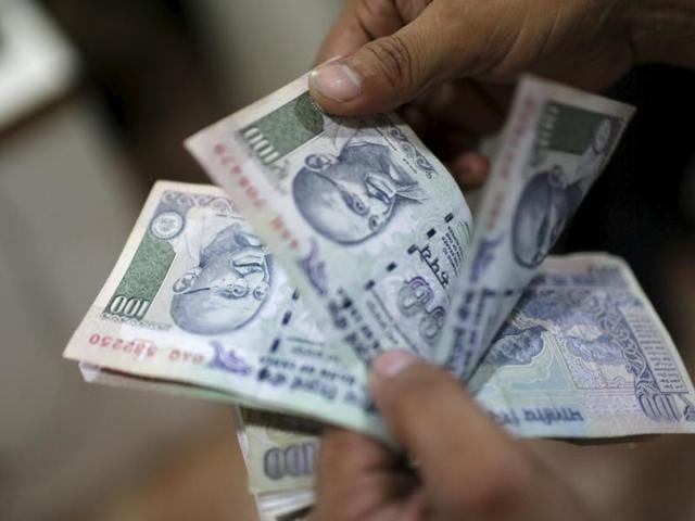 The rupee fell back sharply after a brief rebound from its 29-month low to end at 67.83 against the dollar following a renewed demand for the greenback.(REUTERS)