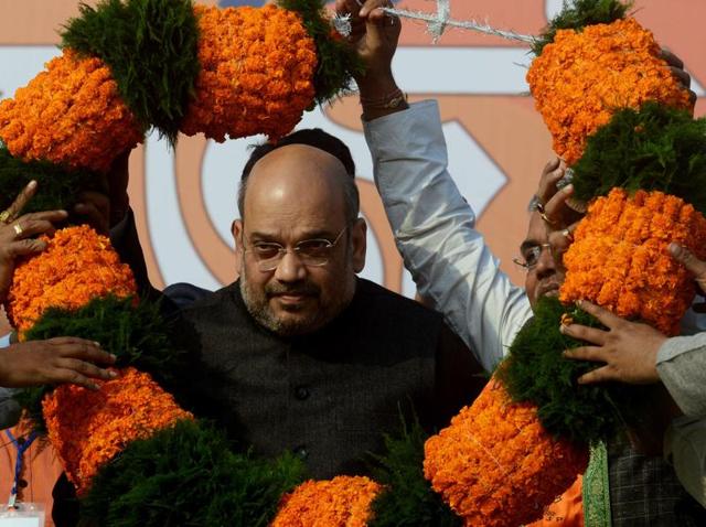 BJP president Amit Shah received a warm welcome from the party workers during a rally in Howrah. (AFP) BJP president Amit Shah received a warm welcome from the party workers during a rally in Howrah. (AFP)