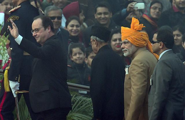 Prime Minister Modi, President Pranab Mukherjee and French President Francois Hollande arrive to attend the 67th Republic Day parade. (PTI) Prime Minister Modi, President Pranab Mukherjee and French President Francois Hollande arrive to attend the 67th Republic Day parade. (PTI)