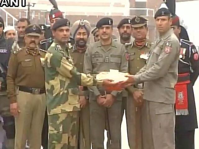 BSF officials exchange sweets with Pakistan Rangers at Attari Border(ANI)