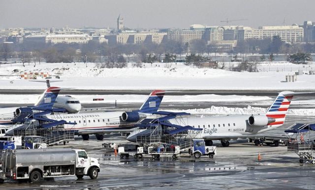 Airlines try to get back to work at Washington's Ronald Reagan National Airport. (AP) Airlines try to get back to work at Washington's Ronald Reagan National Airport. (AP)