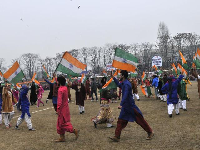 Kashmiri dancers hold national flags as they dance during India's 67th Republic Day celebrations in Srinagar, India 26 January 2016. India celebrated its 67th Republic Day Monday amid tight security in Kashmir.(Photo by Waseem Andrabi/ Hindustan Times) (Waseem Andrabi/HT Photo) Kashmiri dancers hold national flags as they dance during India's 67th Republic Day celebrations in Srinagar, India 26 January 2016. India celebrated its 67th Republic Day Monday amid tight security in Kashmir.(Photo by Waseem Andrabi/ Hindustan Times) (Waseem Andrabi/HT Photo)