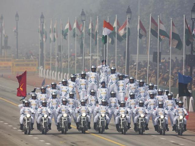 Soldiers make formations on motorcycles as they roll down Rajpath during the Republic Day parade in New Delhi. (AP Photo) 