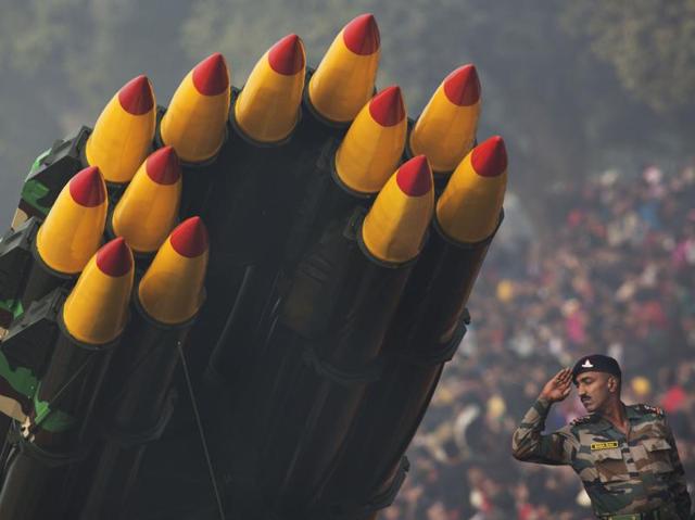 A soldier in charge of multi-barrel rocket launchers salutes President Mukherjee as he participates in the Republic Day parade in New Delhi. (AP Photo) 