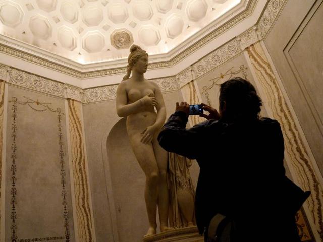 A visitor pictures the Venere Capitolina or Capitoline Venus on display at Rome's Capitoline Museum on January 26, 2016. The visiting Iranian president Hassan Rouhani has denied asking his Italian hosts to cover up the classical nude statues in the museum. (AFP) A visitor pictures the Venere Capitolina or Capitoline Venus on display at Rome's Capitoline Museum on January 26, 2016. The visiting Iranian president Hassan Rouhani has denied asking his Italian hosts to cover up the classical nude statues in the museum. (AFP)