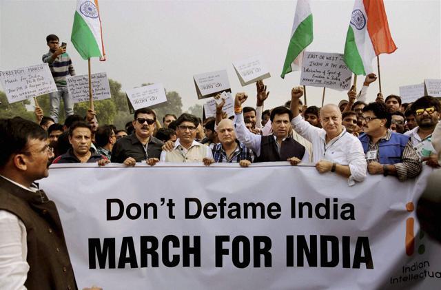 Bollywood actor Anupam Kher and other film personalities march toward the Rashtrapati Bhawan to counter the protests by writers, artists and others against intolerance, in New Delhi. (PTI Photo)