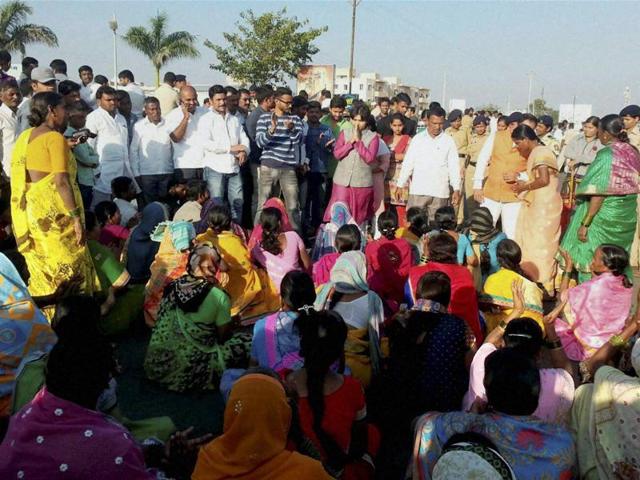 Trupti Desai (in pink) who headed the protest by women activists for entry to the Shani Shignapur temple complex participates in a dharna at the temple. (PTI Photo) Trupti Desai (in pink) who headed the protest by women activists for entry to the Shani Shignapur temple complex participates in a dharna at the temple. (PTI Photo)