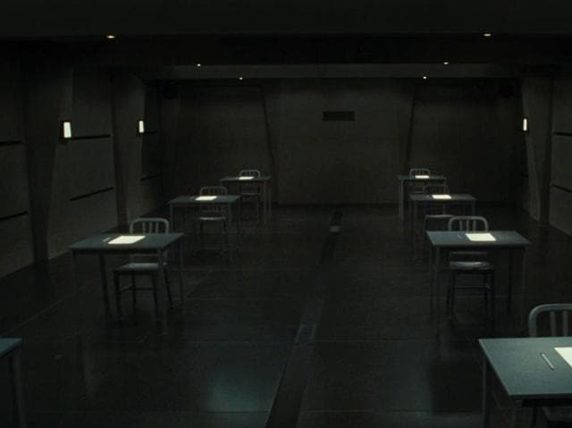 Exam (2009): The final eight candidates for a highly desirable corporate job are locked together in an exam room and given a test with one question. It seems simple yet confusing that soon, tensions begin to unravel.