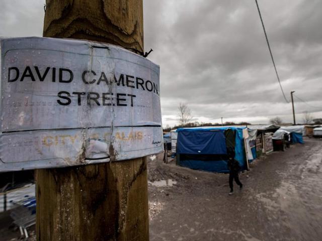 A sign that reads, "David Cameron Street" referring to the British Prime Minister, is seen at the migrants camp known as the 'Jungle' , in the northern French port city of Calais. Migrants are living in notoriously squalid conditions in the sprawling makeshift camp in the hope that they will one day be able to cross the Channel to Britain. (AFP File Photo) A sign that reads, "David Cameron Street" referring to the British Prime Minister, is seen at the migrants camp known as the 'Jungle' , in the northern French port city of Calais. Migrants are living in notoriously squalid conditions in the sprawling makeshift camp in the hope that they will one day be able to cross the Channel to Britain. (AFP File Photo)