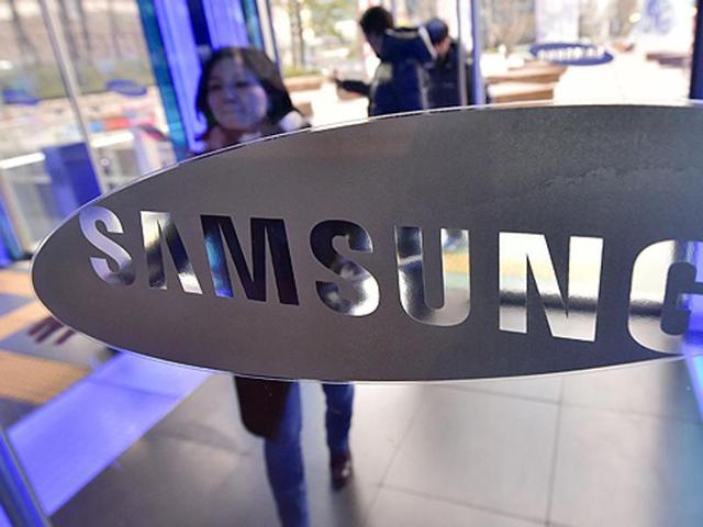 A woman walks past the logo of Samsung Electronics at its showroom in Seoul. (File Photo) A woman walks past the logo of Samsung Electronics at its showroom in Seoul. (File Photo)