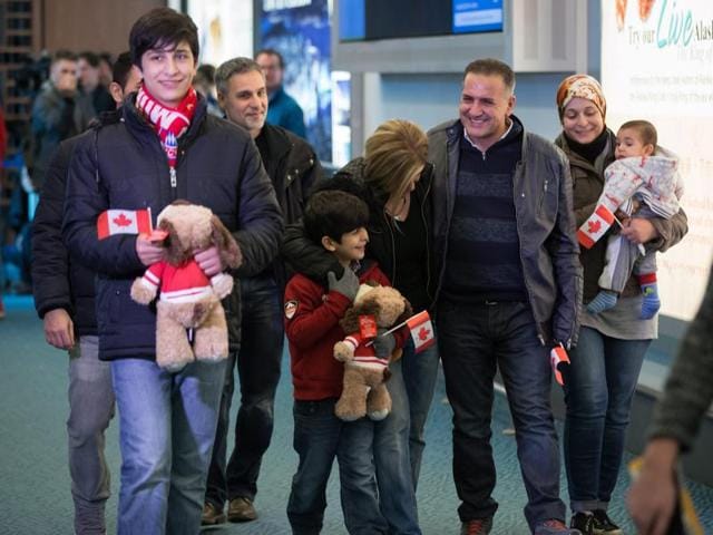 Recently-arrived Syrian refugees meet sponsors and relatives at the Armenian Community Centre in Toronto. (The Canadian Press via AP File Photo) Recently-arrived Syrian refugees meet sponsors and relatives at the Armenian Community Centre in Toronto. (The Canadian Press via AP File Photo)